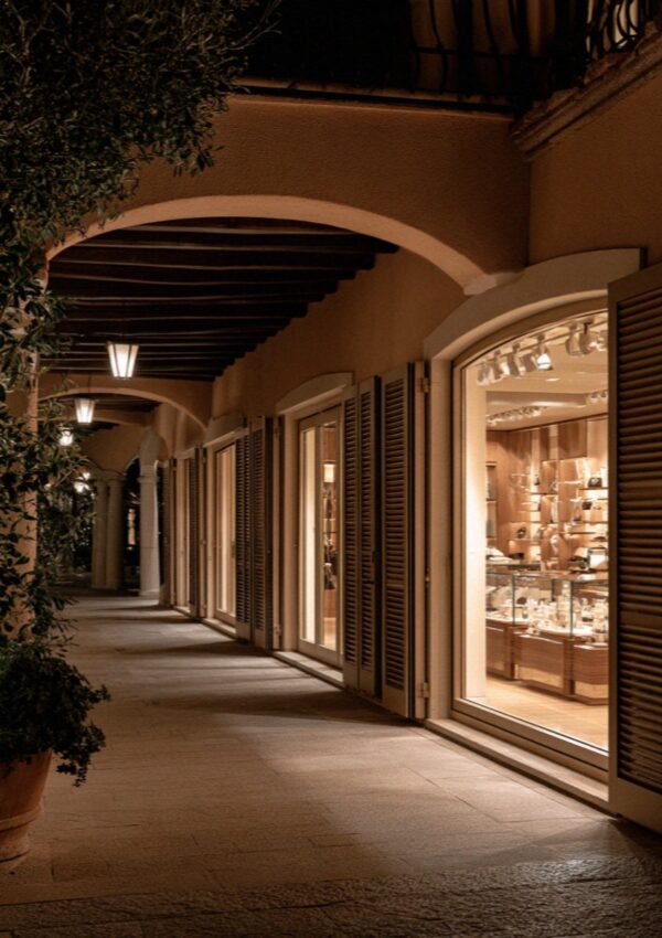 Closed shop windows in the arcade after dark on the Costa Smeralda in Sardinia
