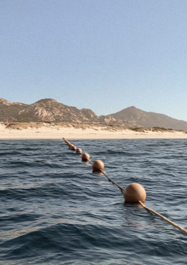 A roped shore seen from the boat in the archipelago north of the Costa Smeralda in Sardinia