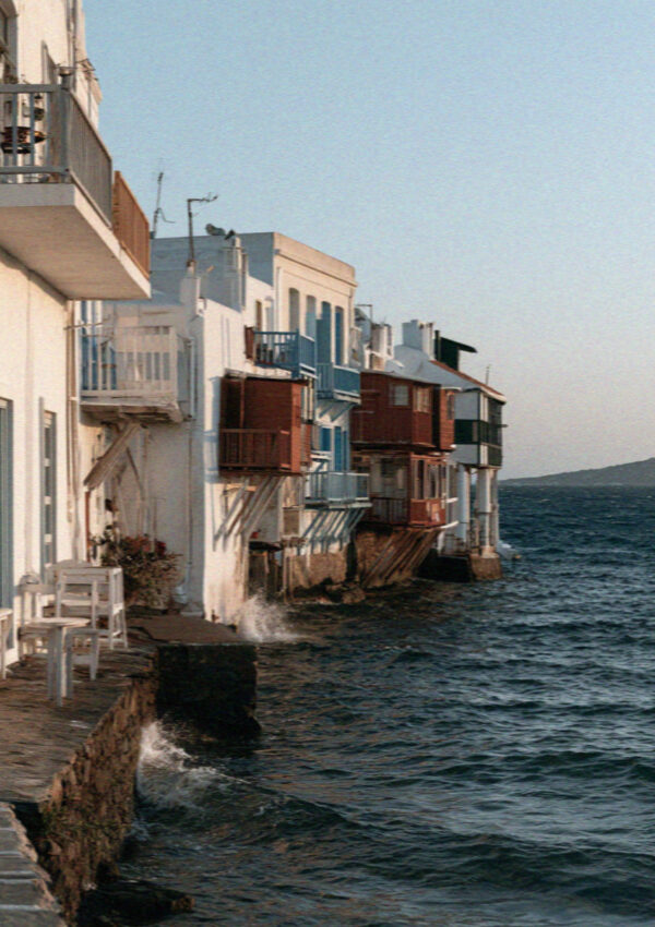 Waterfront houses with wooden balconies hanging directly over the sea at Little Venice in Mykonos