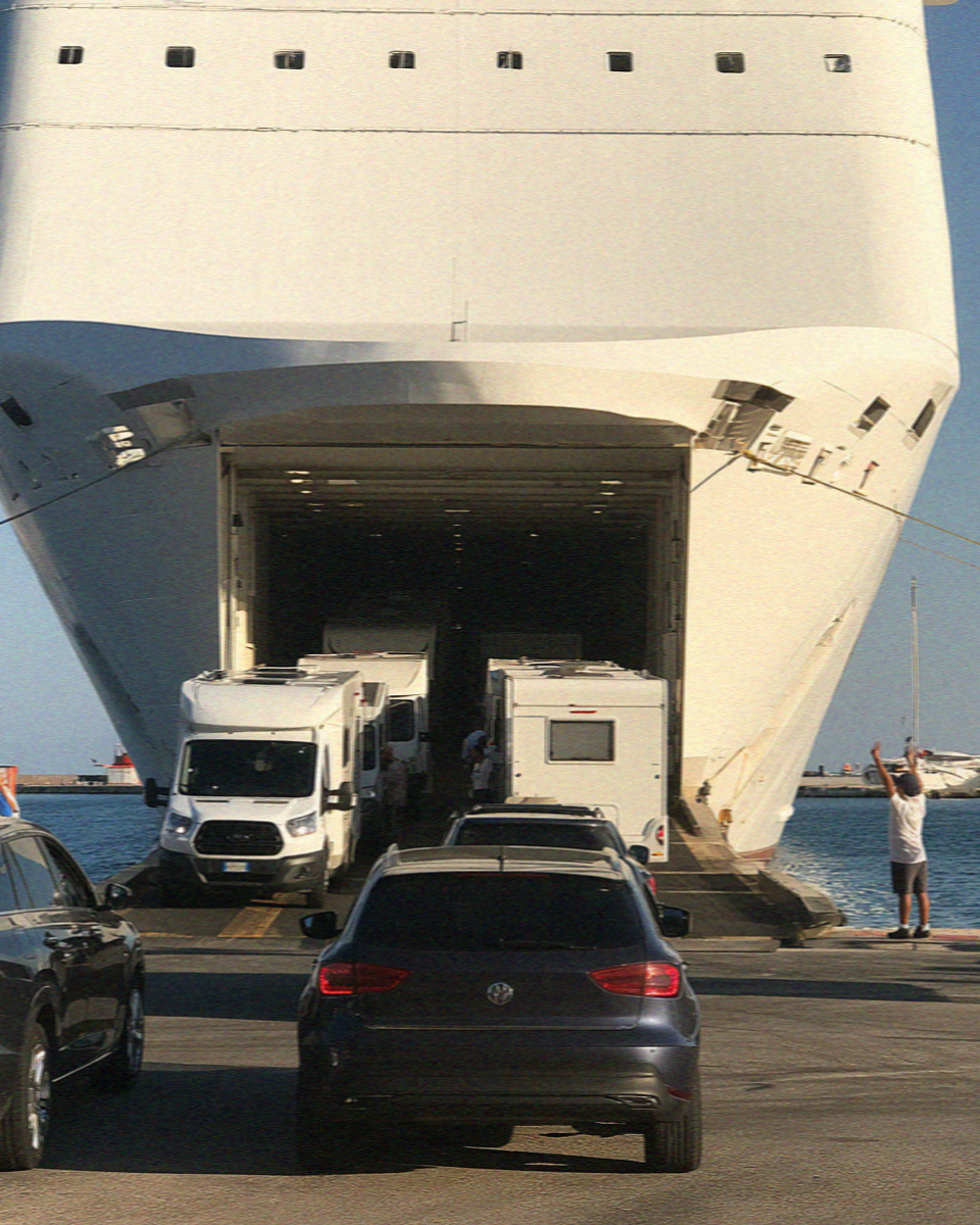 Cars boarding a ferry at the port of Olbia, the sea gateway to the Costa Smeralda in Sardinia