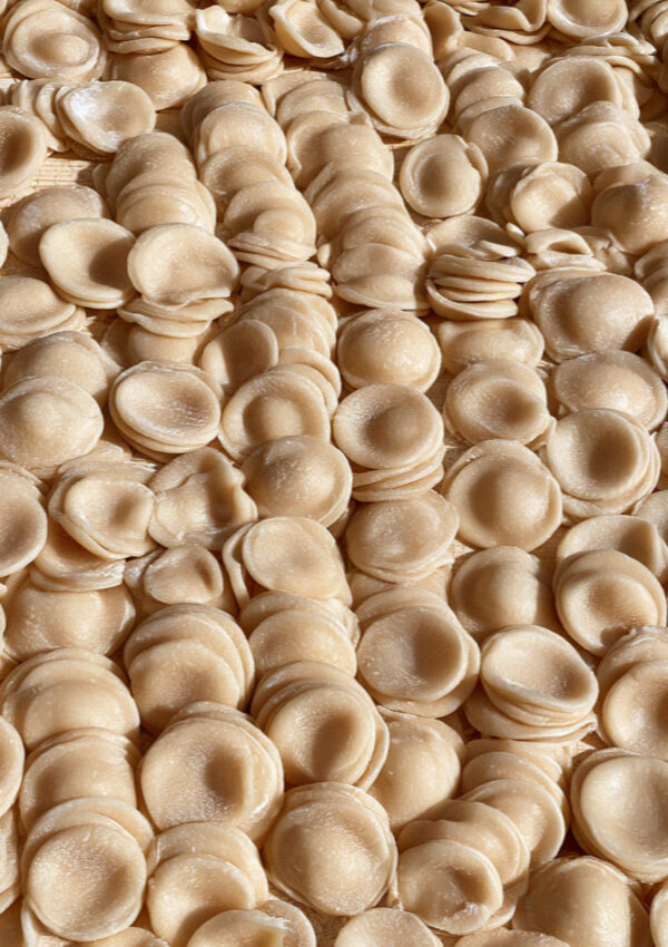 Hand-made orecchiette drying on a board at a farm near Ostuni in Puglia