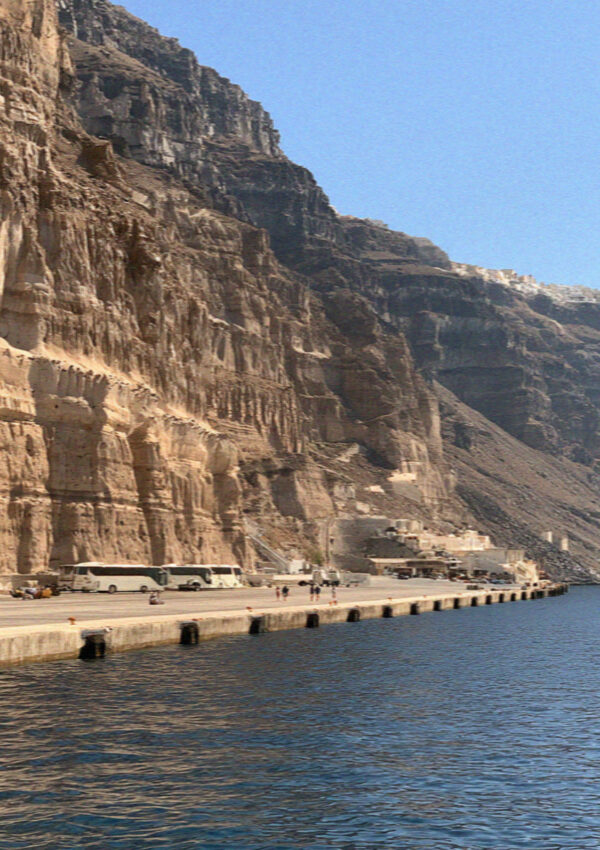 The port at Athinios in Santorini, a concrete shelf at the foot of the cliff