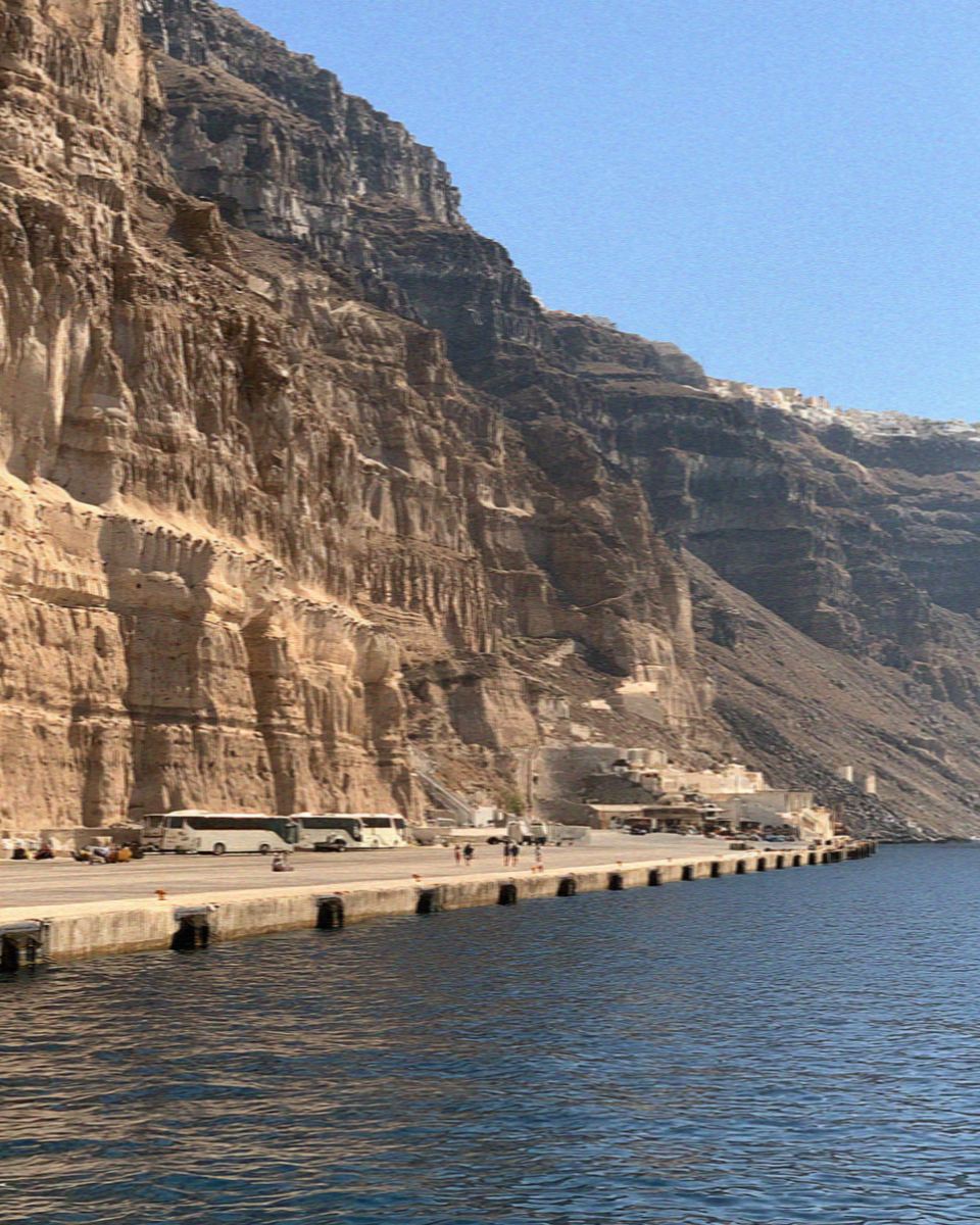 The port at Athinios in Santorini, a concrete shelf at the foot of the cliff