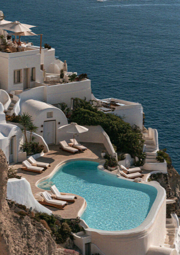 A cliffside pool above the white village in Santorini