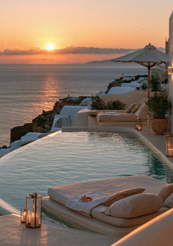 An infinity pool above the caldera in Santorini at sunset