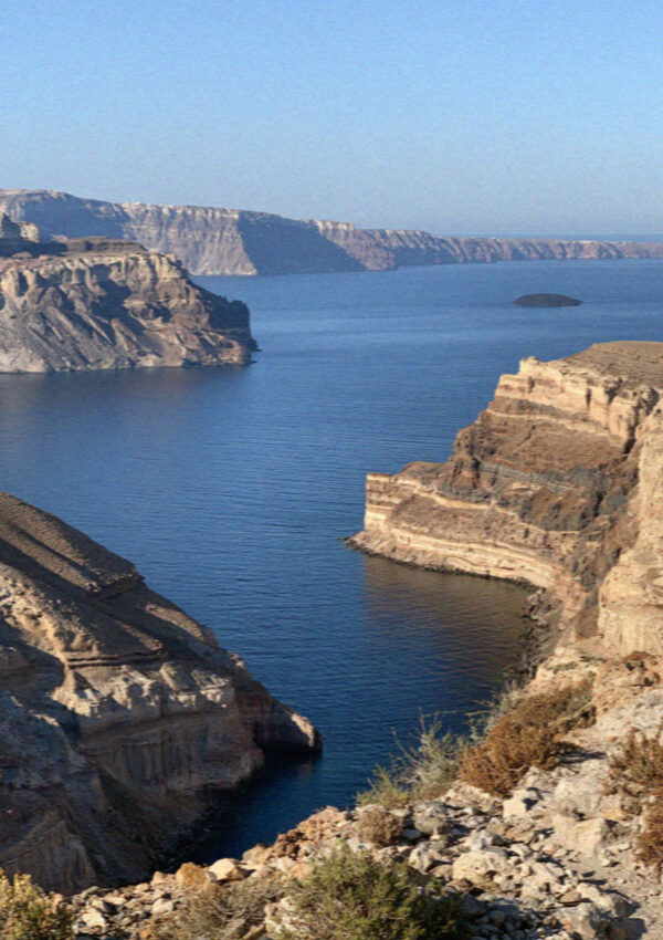 The caldera in Santorini seen from the rim, water filling the broken circle