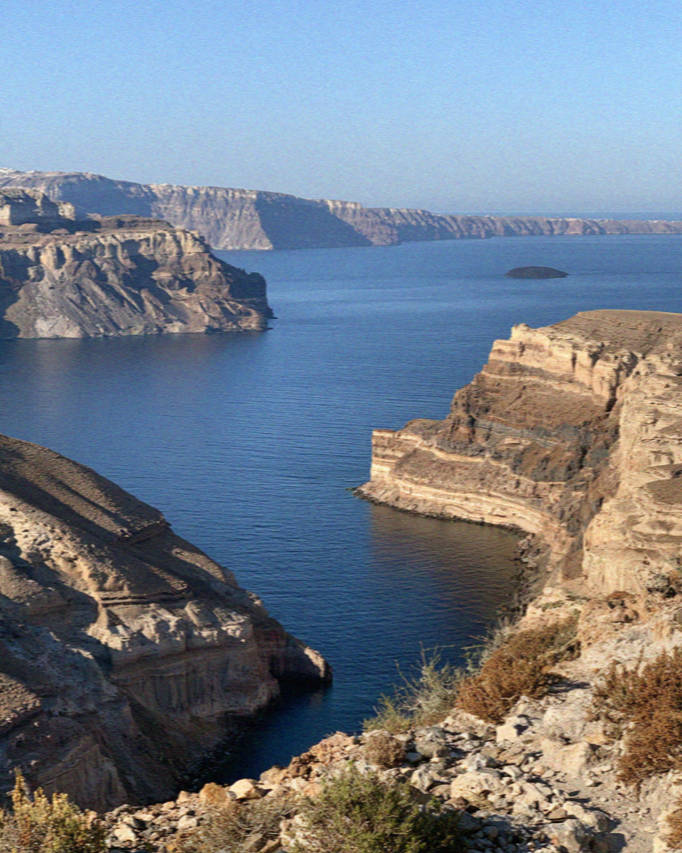 The caldera in Santorini seen from the rim, water filling the broken circle
