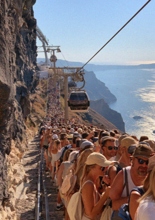 The queue winding down the cliff steps to the old port in Santorini