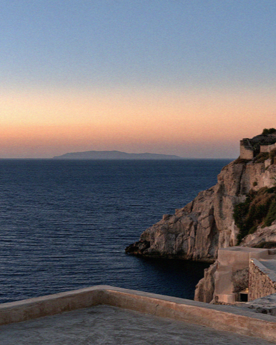 The water below the cliffs in Santorini after the sun has gone