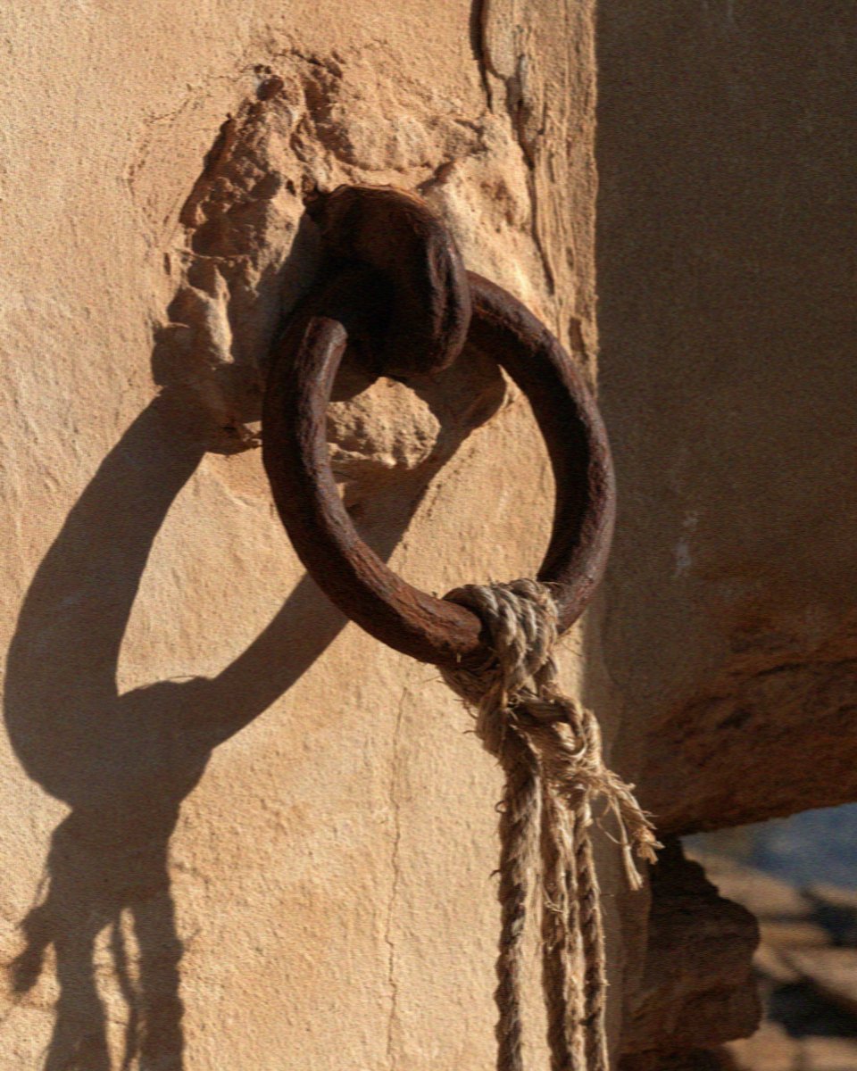 A rusted iron mooring ring set into the wall at the tonnara at Scopello, west of Palermo in Sicily