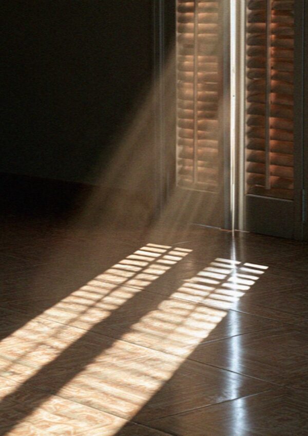 Light through shutter slats falling across tiles in a room at Scopello, west of Palermo in Sicily