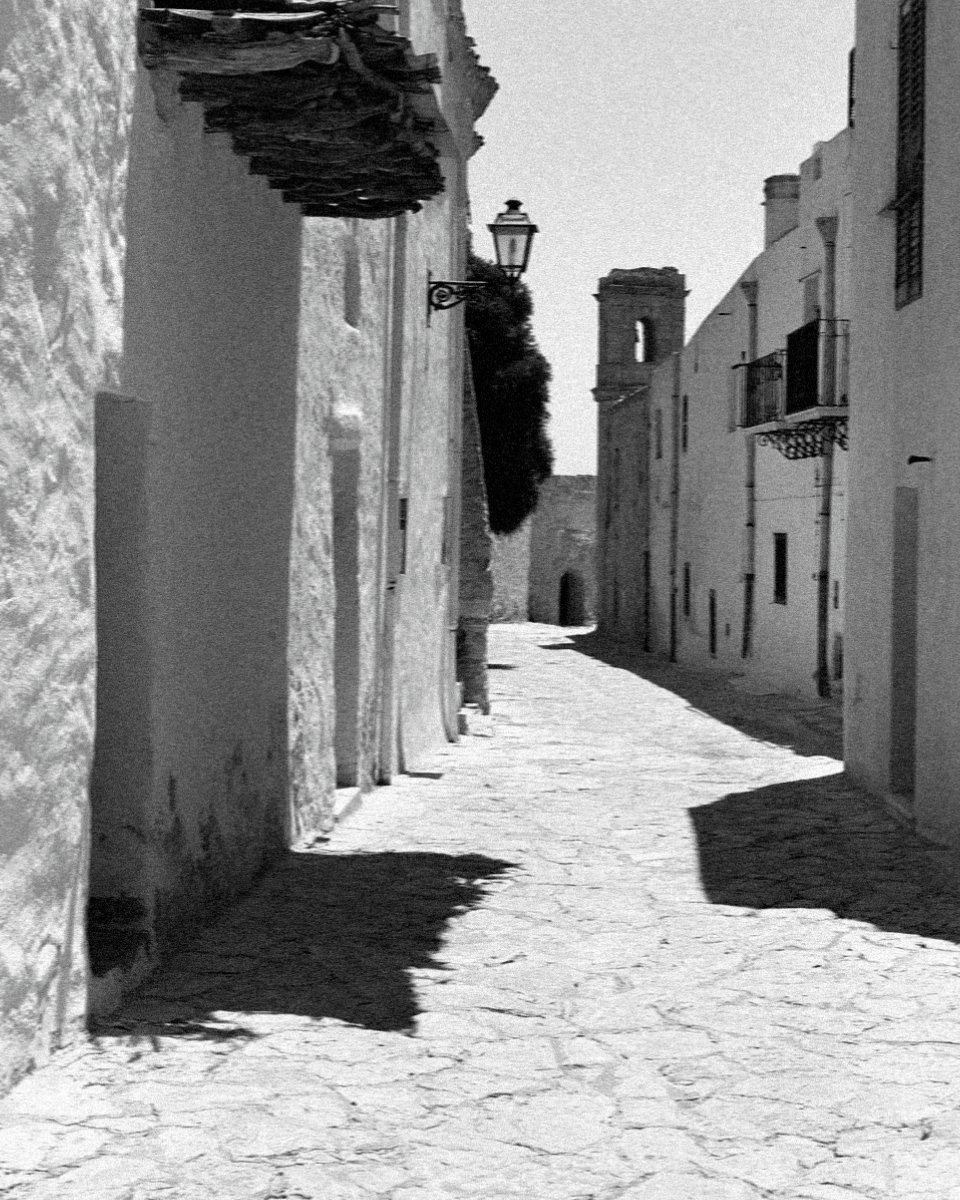 A narrow white lane at Scopello in black and white, west of Palermo in Sicily