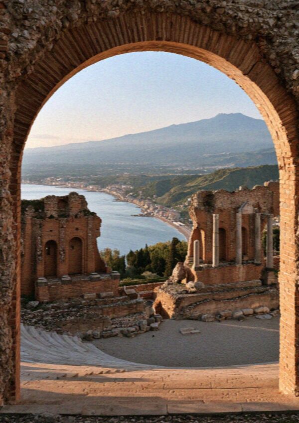 The Greek theatre at Taormina in Sicily with the volcano beyond