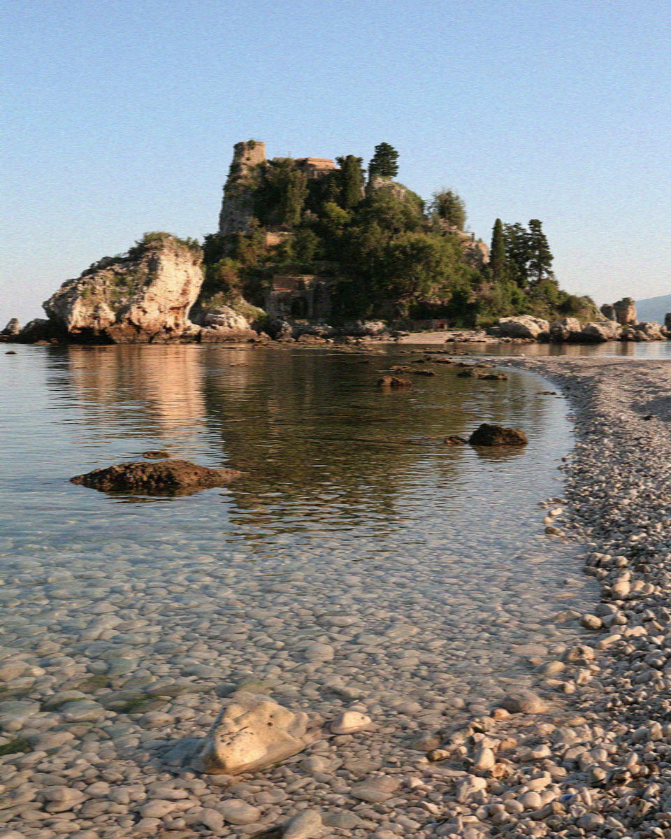 Isola Bella in the bay below Taormina in Sicily seen from a boat