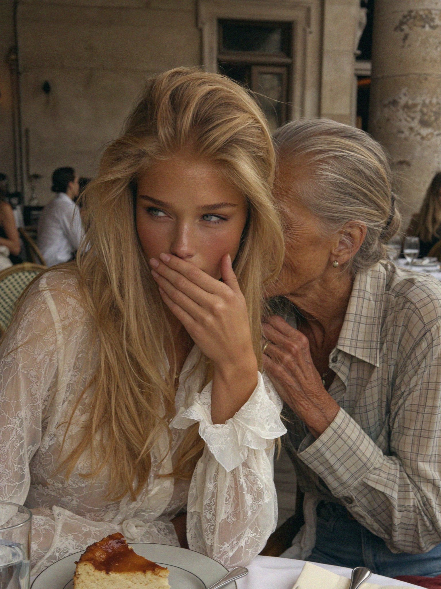 Victoria van der Berg talking to the owner over dessert in Corte in Corsica
