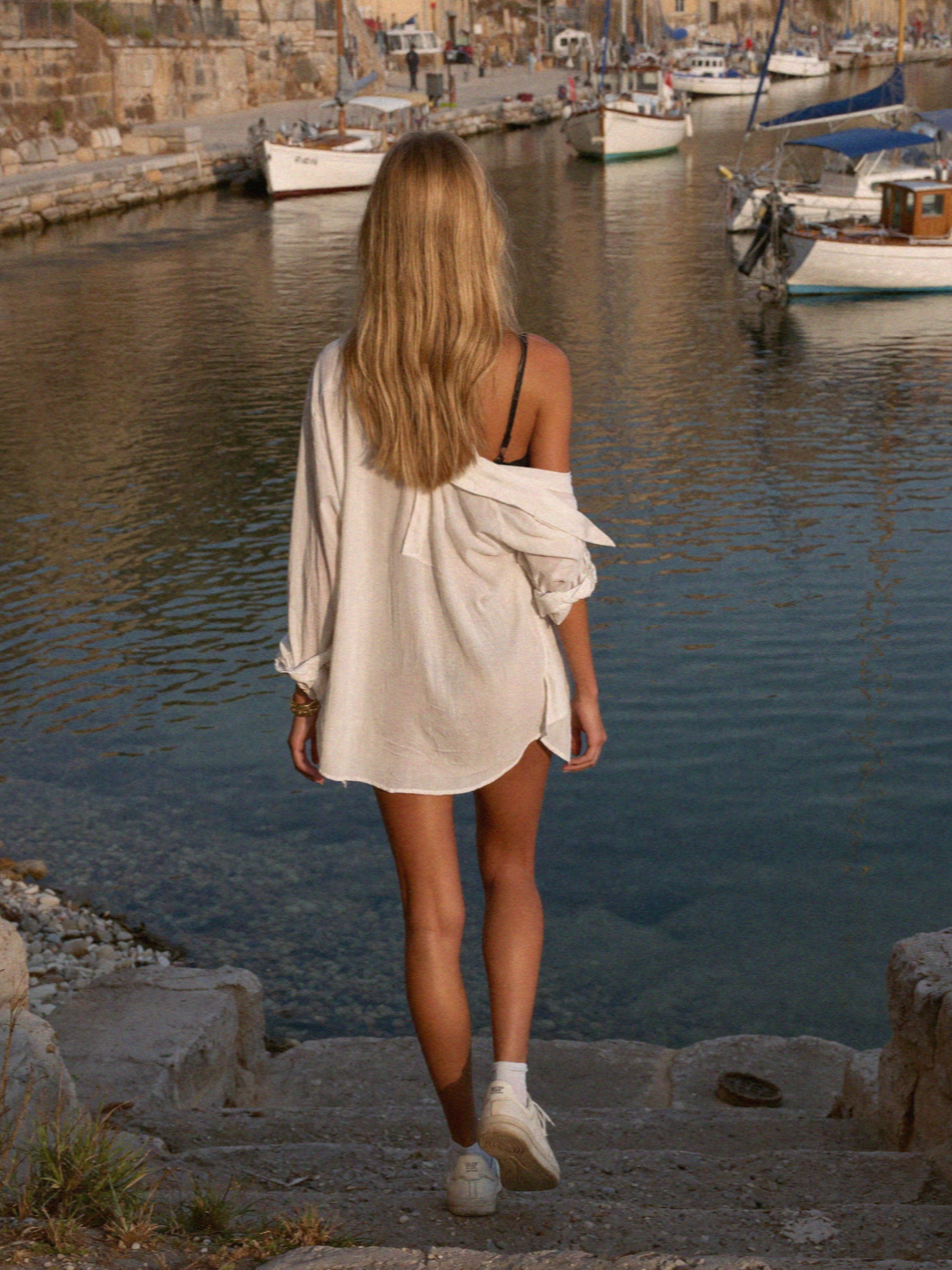 Victoria on the steps down to the beach at Mazzaro below Taormina in Sicily
