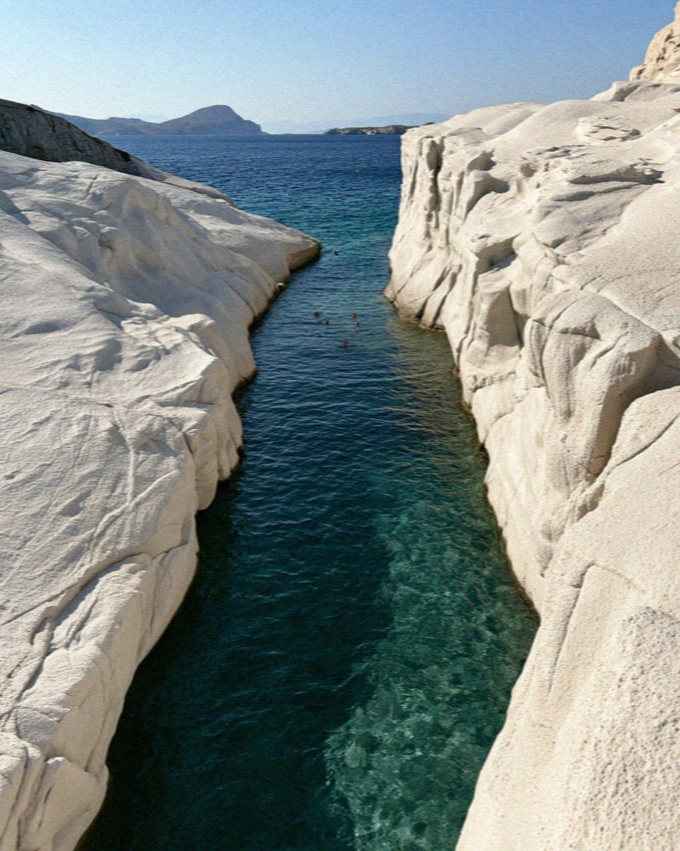 The narrow turquoise channel between the white rocks of Sarakiniko on Milos