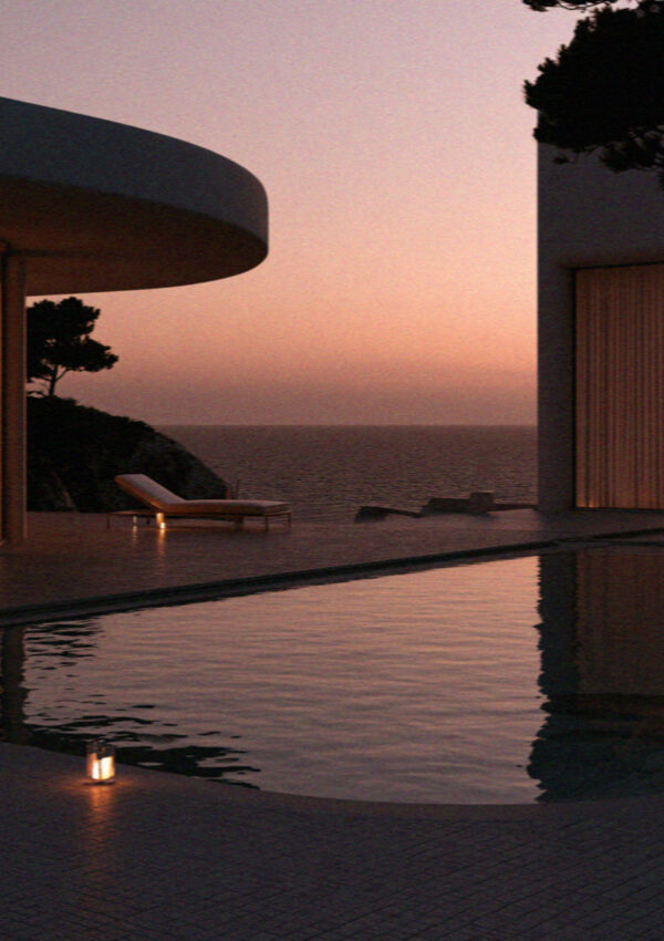 A villa pool and the sea beyond it at sunset on Mykonos