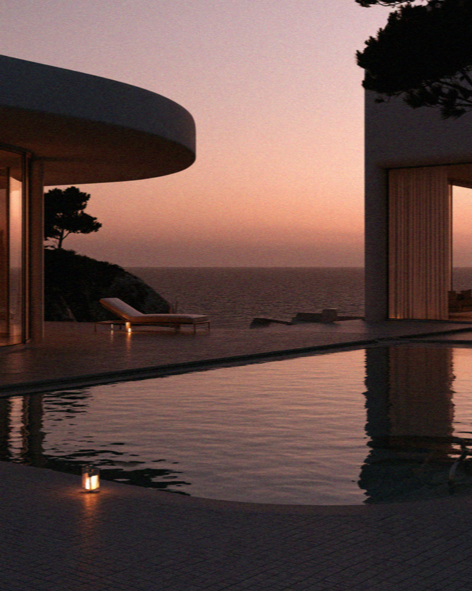 A villa pool and the sea beyond it at sunset on Mykonos